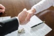 man shaking hands with legal recruiters